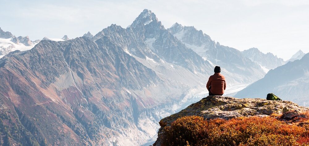 Amazing view on Monte Bianco mountains range with tourist on a foreground